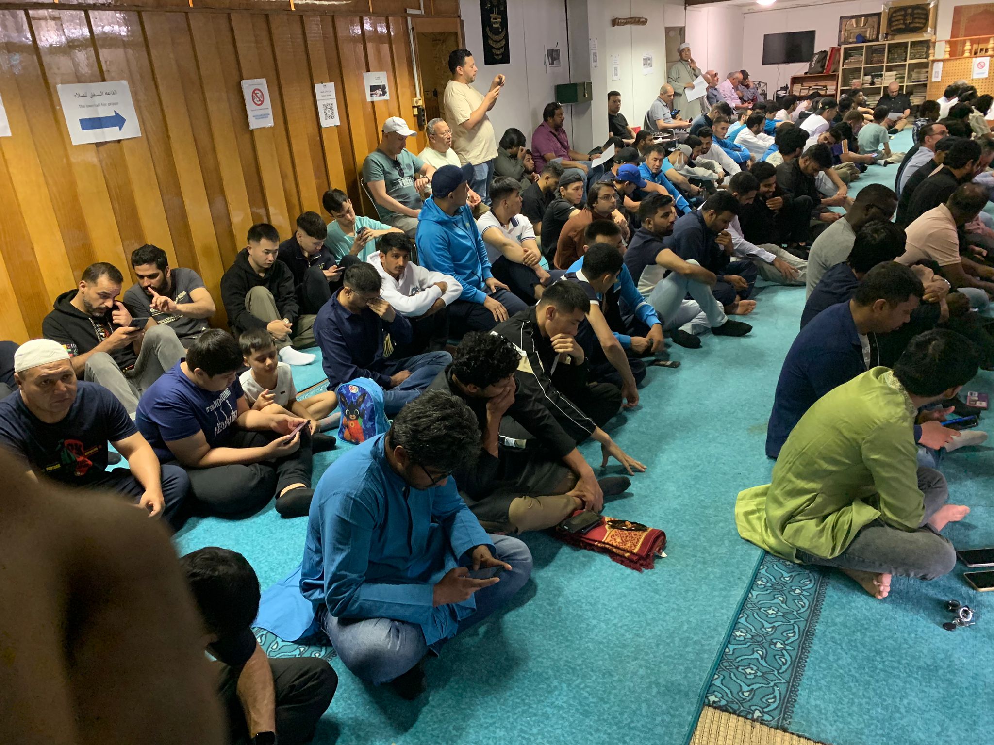 Congregation seated across the prayer hall